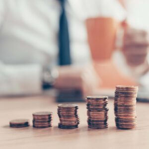 satisfied businessman drinking coffee with coin st p7kqwku